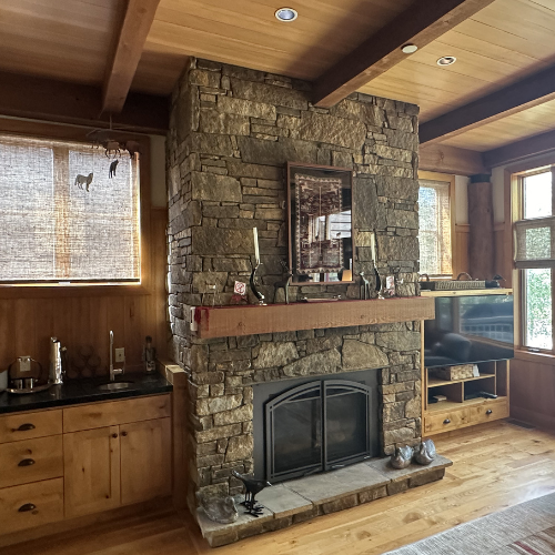 shades in living room, with fire place, brown walls